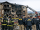 Fire crews respond to a damaged apartment building after a Denver apartment fire